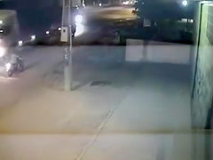 Female motorcyclist gets caught on security cam urinating