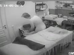 Mature woman reveals her large saggy tits at the massage parlour