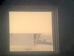 Nude girl spied from the window