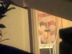 Peeping a girl touch herself in bed