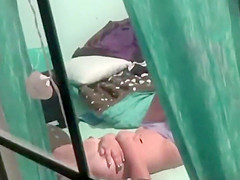 Peeping on a teen 18+ girl through a window
