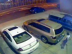 Security camera catches a girl peeing behind a car