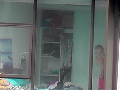 Skinny blonde neighbor walks around her bedroom in underwear