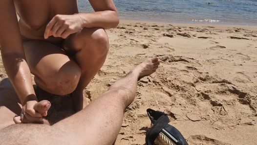 Stepsister gives nude blowjob to stepfather on a beach