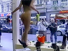 Young flexible looker poses completely naked in the store